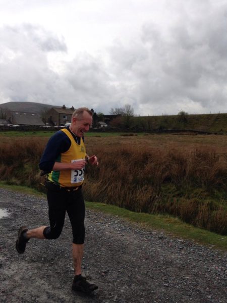 Andy Buck running at Ribblehead, Three Peaks race.