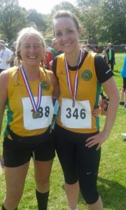 Dawn and Emma with their medals after completing the Holymoorside 10k.