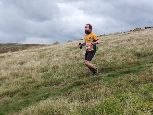 Jim Rangeley running down a hill. It looks like hard work.