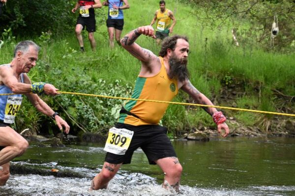 Jim Rangeley crossing a river