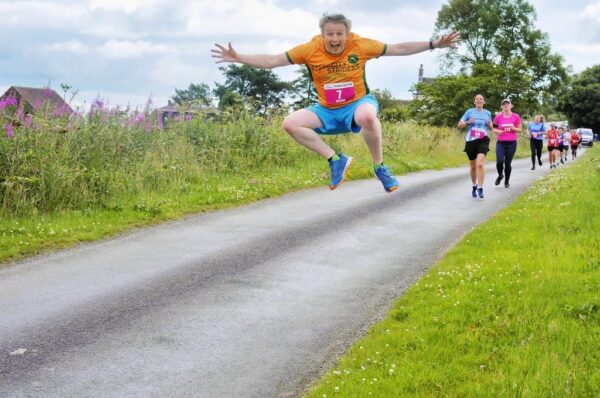 Rich Bailey-Jones leaps in the air during the Ipstones 5ish