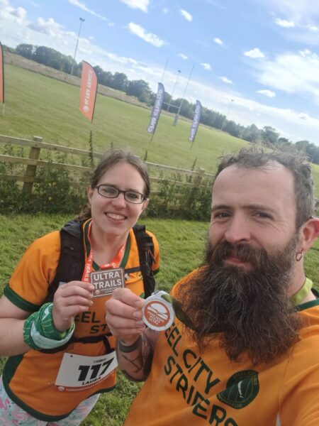 Laura and Jim with medals