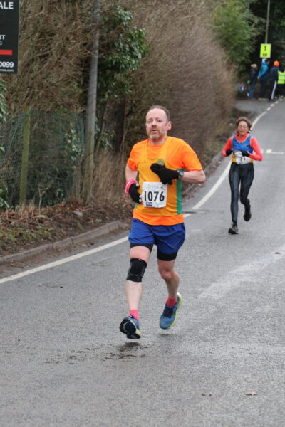 Matt running on a slight uphill looking pooped. 